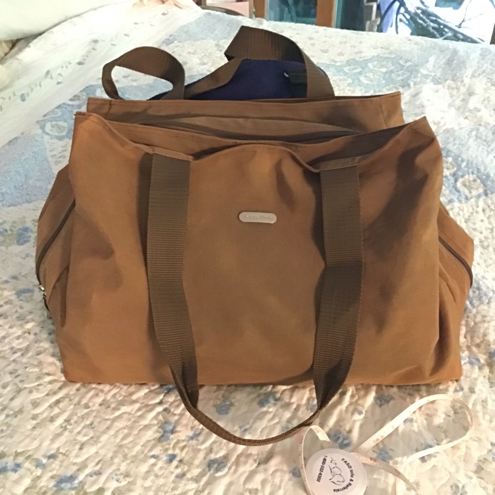 Baggallini khaki tan with light blue interior Zip top Duffel Travel Bag